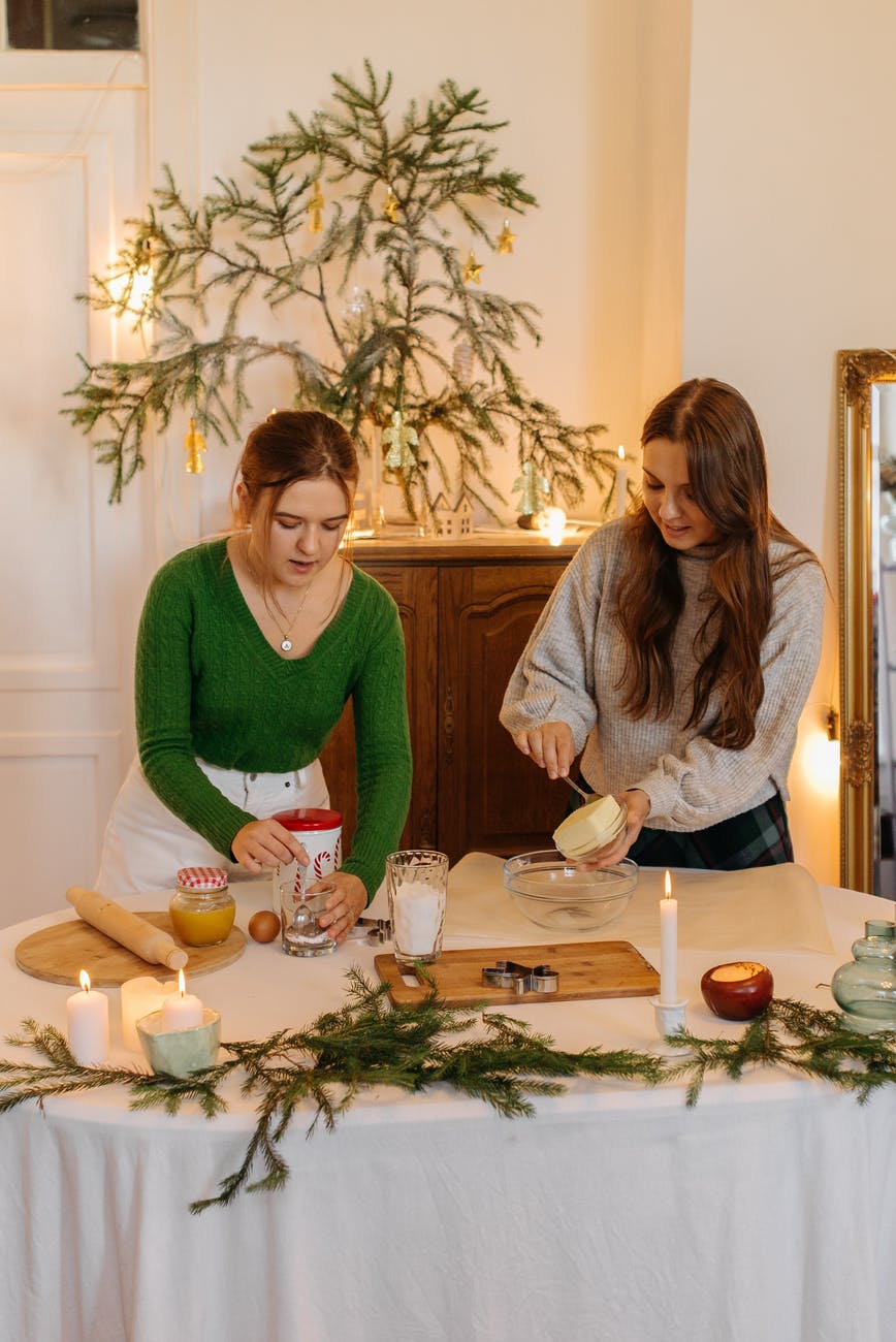 two girls making christmas cookies